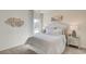 Serene bedroom with plush carpeting, neutral decor, and a bright window view at 929 Maya Layne Dr., Little River, SC 29566