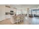Bright kitchen with white cabinets, stainless steel appliances, island and breakfast bar seating at 929 Maya Layne Dr., Little River, SC 29566