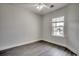 Bedroom features hardwood floors, base molding, and a large window at 999 Algonquin Dr. # E, Pawleys Island, SC 29585