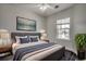 Comfortable bedroom with neutral tones, ceiling fan, large window, and stylish furnishings at 999 Algonquin Dr. # E, Pawleys Island, SC 29585