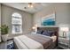 Cozy bedroom featuring a plush bed, ceiling fan, ample natural light, and stylish decor at 999 Algonquin Dr. # E, Pawleys Island, SC 29585