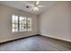 An airy bedroom with hardwood floors, a large window, and white trim at 999 Algonquin Dr. # E, Pawleys Island, SC 29585