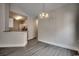 A dining room with modern pendant lighting, and attractive grey floors at 999 Algonquin Dr. # E, Pawleys Island, SC 29585