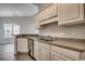 A well-lit kitchen features granite countertops and white cabinets at 999 Algonquin Dr. # E, Pawleys Island, SC 29585