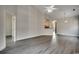 Open floor plan with hardwood floors, fan, and bright lighting at 999 Algonquin Dr. # E, Pawleys Island, SC 29585