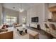 Bright living room featuring high ceilings, modern decor, stylish furnishings, and a walk-out balcony at 999 Algonquin Dr. # E, Pawleys Island, SC 29585