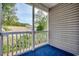Screened porch with blue carpeting and outdoor view at 999 Algonquin Dr. # E, Pawleys Island, SC 29585
