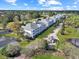 Aerial view of the condo complex with well manicured grounds and a charming pond in a golf course community at 1009 World Tour Blvd. # 103, Myrtle Beach, SC 29579