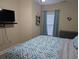 Well-appointed bedroom with a ceiling fan and modern decor on a queen-sized bed at 1009 World Tour Blvd. # 103, Myrtle Beach, SC 29579