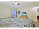 Comfortable bedroom offering a ceiling fan and a flat screen television in a clean living space at 1009 World Tour Blvd. # 103, Myrtle Beach, SC 29579