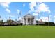 Grand clubhouse with a neoclassical design, featuring stately columns and a perfectly manicured lawn at 1009 World Tour Blvd. # 103, Myrtle Beach, SC 29579