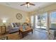 Comfortable living room with a slider door to the patio and modern decor at 1009 World Tour Blvd. # 103, Myrtle Beach, SC 29579