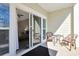 Outdoor patio with furniture and a sliding glass door to the interior at 1009 World Tour Blvd. # 103, Myrtle Beach, SC 29579