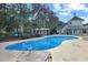 Inviting outdoor pool area featuring a pergola, lounge chairs, and a pristine pool at 1009 World Tour Blvd. # 103, Myrtle Beach, SC 29579