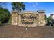 Stone community sign for Garden Creek with manicured landscaping and a palm tree in the background at 117 Butkus Dr. # 1, Myrtle Beach, SC 29588