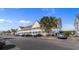 Condo exterior showcasing multiple units, parking area, and surrounding greenery at 117 Butkus Dr. # 1, Myrtle Beach, SC 29588