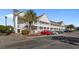 A condo exterior shows multiple units with parking and lush landscaping at 117 Butkus Dr. # 1, Myrtle Beach, SC 29588