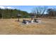 Outdoor grilling area with stone table, benches, and barbecue grills at 117 Butkus Dr. # 1, Myrtle Beach, SC 29588