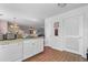 Bright kitchen with essential appliances, storage cabinets, and access to more of the house at 117 Butkus Dr. # 1, Myrtle Beach, SC 29588