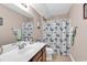 Charming bathroom with a butterfly-themed shower curtain, vanity, and a bright, airy atmosphere at 120 Henry Middleton Blvd., Myrtle Beach, SC 29588