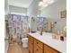 Bright bathroom with a white vanity, a large mirror, and a shower-tub combination at 120 Henry Middleton Blvd., Myrtle Beach, SC 29588