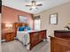 Cozy bedroom with a wooden bed frame, soft carpet, and an inviting atmosphere for restful nights at 120 Henry Middleton Blvd., Myrtle Beach, SC 29588