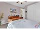 Bedroom with a wooden dresser, closet and bed, with natural light enhancing the cozy atmosphere at 120 Henry Middleton Blvd., Myrtle Beach, SC 29588