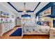Elegant bedroom with blue accents, a ceiling fan, and a serene view of the lake at 120 Henry Middleton Blvd., Myrtle Beach, SC 29588