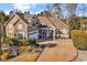 Inviting exterior of a well-maintained home featuring a stone facade, manicured landscaping, and a spacious driveway at 120 Henry Middleton Blvd., Myrtle Beach, SC 29588