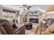 Inviting living room with comfortable seating, modern ceiling fan, and a large window for natural light at 120 Henry Middleton Blvd., Myrtle Beach, SC 29588