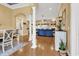 Open-concept living space with hardwood floors, decorative pillars, comfortable furniture, and natural light at 120 Henry Middleton Blvd., Myrtle Beach, SC 29588