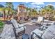 Cozy outdoor patio with a stone fireplace, comfortable seating, and a warm ambiance for gatherings at 120 Henry Middleton Blvd., Myrtle Beach, SC 29588