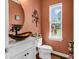 Charming powder room featuring modern fixtures, decorative mirror, and natural lighting at 120 Henry Middleton Blvd., Myrtle Beach, SC 29588