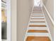 Elegant staircase with wooden steps and white risers, leading to upper levels of the home at 120 Henry Middleton Blvd., Myrtle Beach, SC 29588