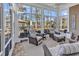 Bright sunroom with wicker furniture and scenic lake views at 120 Henry Middleton Blvd., Myrtle Beach, SC 29588