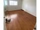 Bedroom with laminated wood floors, window, and natural light at 1200 5Th Ave. N # 1407, Surfside Beach, SC 29575