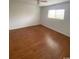 Bedroom features laminate floors and a window letting in natural light at 1200 5Th Ave. N # 1407, Surfside Beach, SC 29575