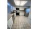 Clean kitchen features stainless steel appliances and checkered tile floor at 1200 5Th Ave. N # 1407, Surfside Beach, SC 29575