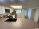 Kitchen features a stainless steel refrigerator, sink, and white cabinetry at 1200 5Th Ave. N # 1407, Surfside Beach, SC 29575