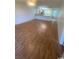 Open-concept living room has laminated wood floors and natural lighting at 1200 5Th Ave. N # 1407, Surfside Beach, SC 29575