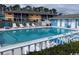 Community swimming pool with ample seating on the deck at 1200 5Th Ave. N # 1407, Surfside Beach, SC 29575