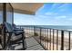 Oceanfront balcony furnished with chairs, overlooking the beach and ocean for relaxed outdoor living at 1210 N Waccamaw Dr. # 212, Garden City Beach, SC 29576
