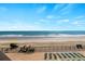 Breathtaking beach view from the property, showcasing a sandy shore and clear ocean at 1210 N Waccamaw Dr. # 212, Garden City Beach, SC 29576