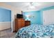 Comfortable bedroom with wicker furniture and a flat screen television at 1210 N Waccamaw Dr. # 212, Garden City Beach, SC 29576