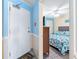 Bright condo bedroom with a queen bed, ceiling fan and a TV at 1210 N Waccamaw Dr. # 212, Garden City Beach, SC 29576