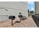 Outdoor grills and seating area on a brick-paved terrace at 1210 N Waccamaw Dr. # 212, Garden City Beach, SC 29576