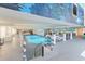 Beautiful indoor pool with adjacent seating and beach themed mural at 1210 N Waccamaw Dr. # 212, Garden City Beach, SC 29576