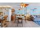 Bright living space with a dining area featuring coastal decor and comfortable seating adjacent to kitchen area at 1210 N Waccamaw Dr. # 212, Garden City Beach, SC 29576