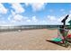 Paved oceanfront game area with cornhole boards and ocean views at 1210 N Waccamaw Dr. # 212, Garden City Beach, SC 29576