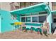 Quaint outdoor dining area with tables and chairs at 1210 N Waccamaw Dr. # 212, Garden City Beach, SC 29576